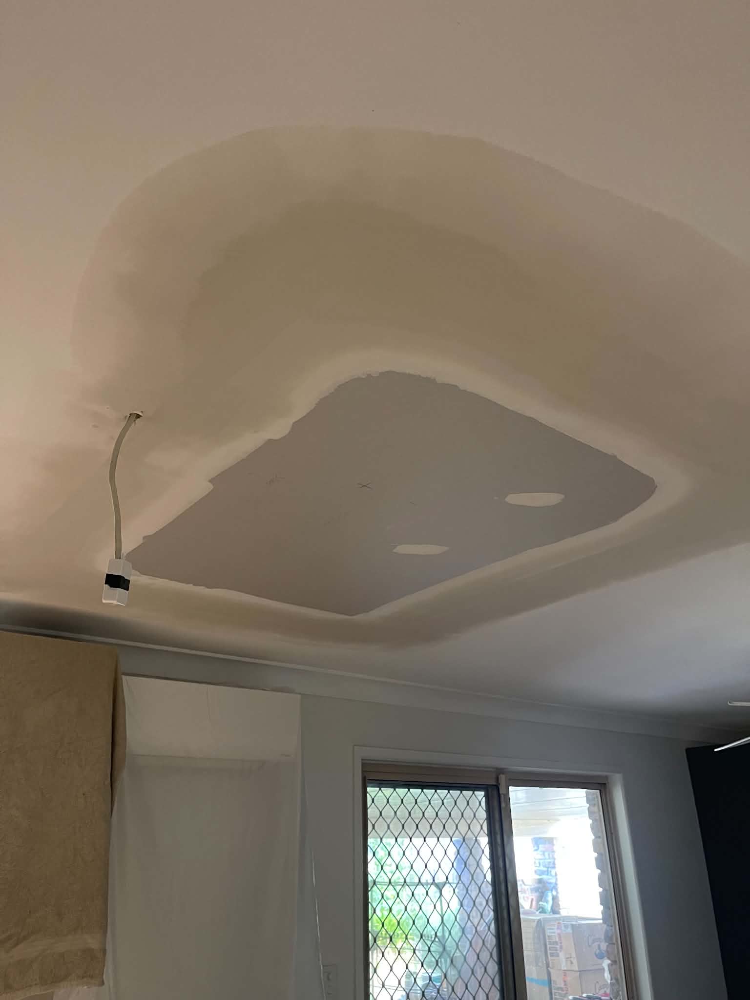 Ceiling repair with an access patch feathered into the surrounding sheet